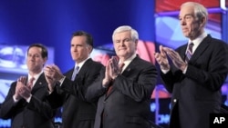 Republican presidential candidates, former Pennsylvania Sen. Rick Santorum, former Massachusetts Gov. Mitt Romney, former House Speaker Newt Gingrich and Rep. Ron Paul, R-Texas, take the stage before the start of the Republican presidential candidate deba