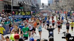 FILE - Runners approach the finish line of the 120th Boston Marathon, in Boston, Massachusetts, April 18, 2016.