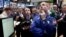 Specialist Patrick Kenny, foreground right, works his post on the floor of the New York Stock Exchange, March 1, 2013.