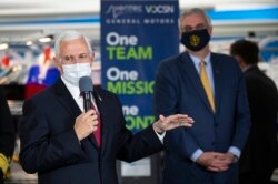 FILE - Vice President Mike Pence speaks during a visit to the General Motors/Ventec ventilator production facility with Indiana Gov. Eric Holcomb in Kokomo, Indiana, April 30, 2020.