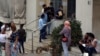 FILE - Ethiopian migrants wait to be helped outside the Ethiopian embassy in Beirut, July 16, 2020, during the COVID-19 pandemic. 