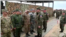 Military members salute a Russian general during joint military exercises of the Shanghai Cooperation Organization (SCO) in Russia's Orenburg region, in an image from video released by Pakistan Army’s media wing ISPR.