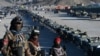 Taliban Humvees are seen parked during the funeral ceremony of Khalil Ur-Rahman Haqqani, the minister for refugees and repatriation, in Sarana, Afghanistan, on Dec. 12, 2024.