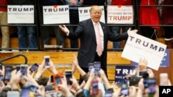 FILE - Republican presidential candidate Donald Trump gestures during a rally at Radford University in Radford, Va., Feb. 29, 2016. 