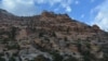 Hiking up the steep, sheer face of this massive rock with no preset trail requires walking sideways and navigating loose stones.