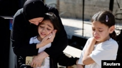 Mourners react during the funeral of Palestinians who were killed in an airstrike during an Israeli raid, in Tubas in the Israeli-occupied West Bank, Sept. 13, 2024.