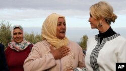 Farmer Aicha Bourkib talks to Ivanka Trump, the daughter and senior adviser to President Donald Trump, in the province of Sidi Kacem, Morocco, Nov. 7, 2019.