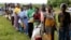 FILE—Malawians queue for food aid distributed by the United Nations World Food Program in Mzumazi village near the capital Lilongwe, February 3, 2016. 