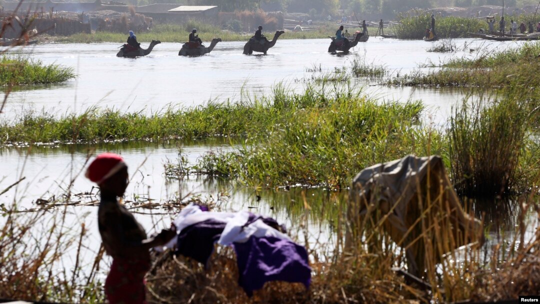FILE - Nigerians fleeing Boko Haram attacks continue to enter Chad, at Lake Chad at Ngouboua.