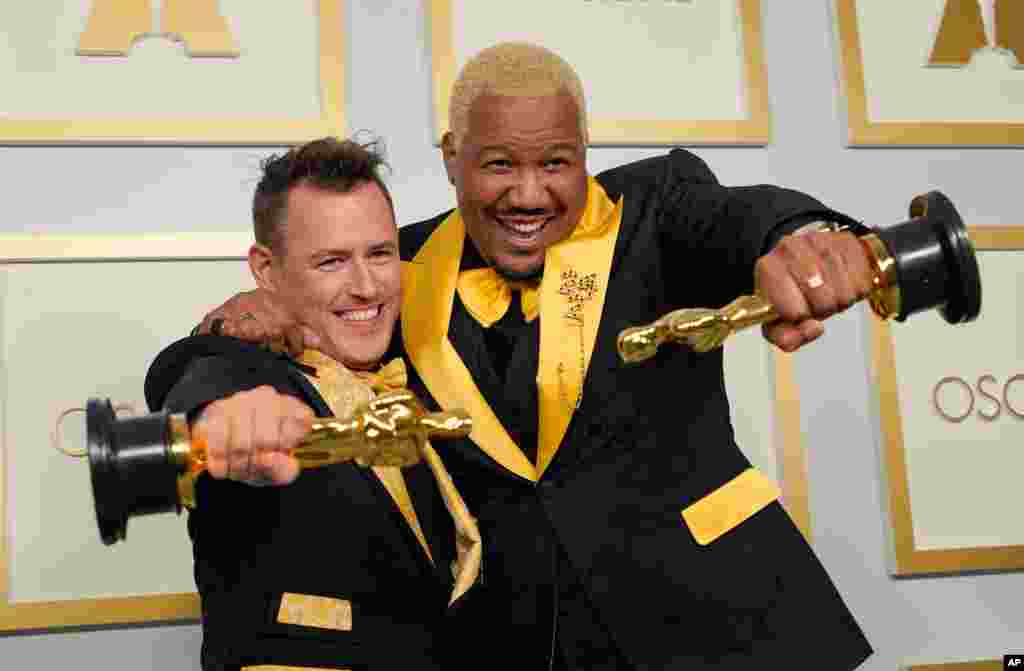 Martin Desmond Roe, left, and Travon Free pose with award for best live action short film for &quot;Two Distant Strangers&quot; in the press room at the Oscars on Sunday, April 25, 2021, at Union Station in Los Angeles. (AP Photo/Chris Pizzello, Pool)