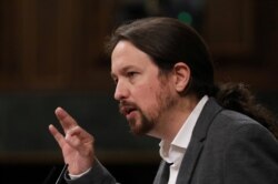 FILE - Podemos leader Pablo Iglesias speaks during a plenary session at Parliament in Madrid, Spain, Sept. 11, 2019.