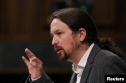 FILE - Podemos leader Pablo Iglesias speaks during a plenary session at Parliament in Madrid, Spain, Sept. 11, 2019.