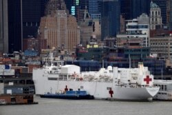 The USNS hospital ship Comfort is seen docked at Pier 90 on Manhattan's West Side during the outbreak of the coronavirus disease (COVID-19) in New York City, April 3, 2020.