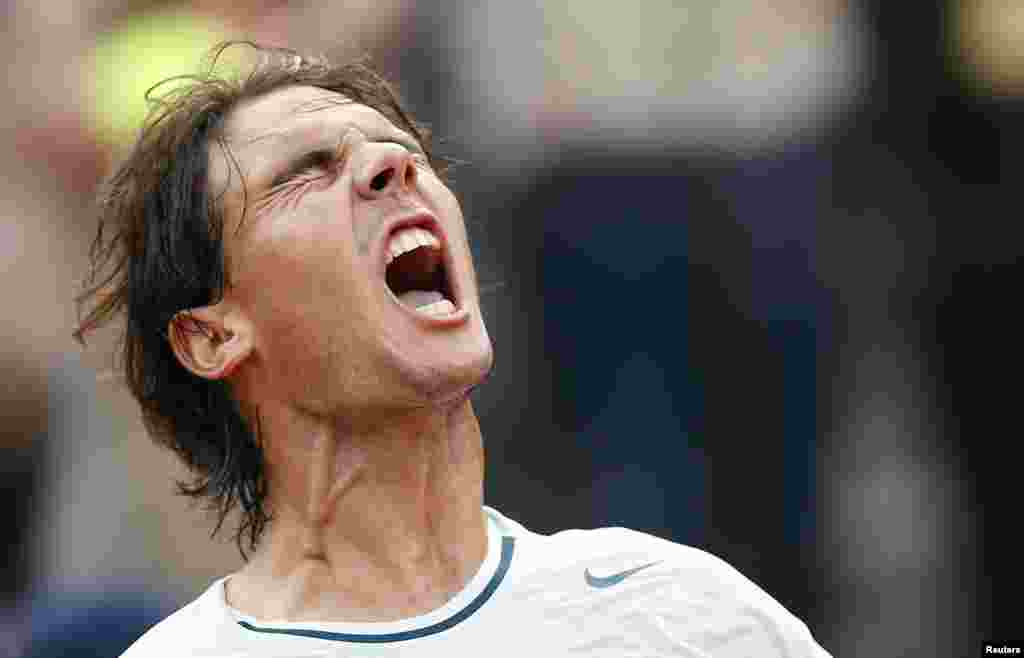 Rafael Nadal of Spain celebrates after winning men&#39;s singles match against Ernests Gulbis of Latvia at the Rome Masters tennis tournament, Italy. 