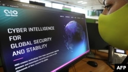 A woman checks the website of Israel-made Pegasus spyware at an office in the Cypriot capital, Nicosia, on July 21, 2021.