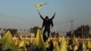 Syrian Kurds hold flags as they gather in Hasakah, Syria, after Turkey's jailed militant leader Abdullah Ocalan called on his Kurdistan Workers' Party to lay down its arms, Feb. 27, 2025.