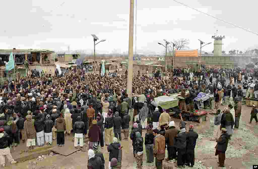 Afghans shout slogans in front of the US base of Bagram during an anti US demonstration in Bagram north of Kabul, Afghanistan, February 21, 2012. (AP)