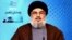 In this photo released by the Syrian official news agency SANA, Hezbollah chief Hassan Nasrallah, gives a televised speech from an unknown location, May 25, 2013