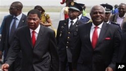 Benin President Boni Yayi, left, walks with Sierra Leone President, Ernest Bai Koroma, on arrival at the airport in Abidjan, Monday, Jan. 3, 2011. African leaders returned to Ivory Coast on Monday in their second visit in a week as they stepped up pressur