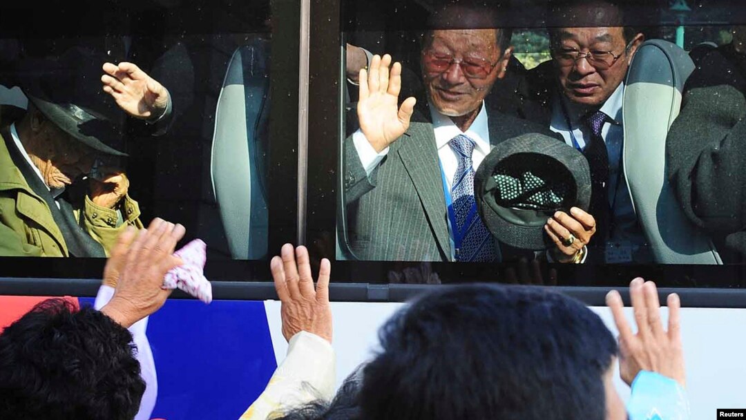 South Koreans on a bus bid farewell to their North Korean relatives after temporary family reunions at Mount Kumgang resort in North Korea, in this November 5, 2010, file photo.