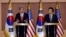 U.S. Secretary of State John Kerry, left, answers reporters' question as South Korean Foreign Minister Yun Byung-se listens during a joint press conference at Foreign Ministry in Seoul, South Korea, April 12, 2013.