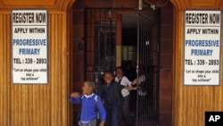 Students run out of the main door as they leave the Progressive Primary in Johannesburg (2010 file photo). Progressive Primary is among an increasing number of such schools for poor South Africans underserved by a government that has struggled to close th