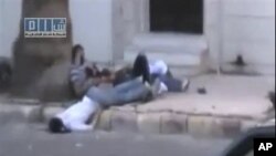 Baadhi ya miili ya watu waliokufa na majeruhi katika mji wa Homs nchini Syria wakati serikali ilipovamia mji huo dhidi ya wapinzani, August 11,2011