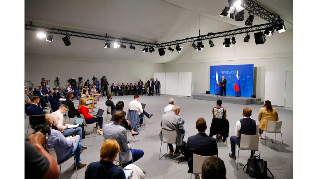 Russia's President Vladimir Putin stands on a podium as he addresses the media during a press conference after the U.S.-Russia summit with U.S. President Joe Biden at Villa La Grange in Geneva, Switzerland, June 16, 2021.