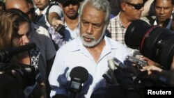 East Timor Prime Minister Xanana Gusmao speaks to reporters after voting in a polling station during parliamentary elections in Dili, July 7, 2012. 