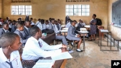 A teacher gives a lesson to his students at Wampewo Ntakke Secondary School in Kawempe tula village, Kampala, Uganda on Nov. 4, 2024. (AP Photo/Hajarah Nalwadda)