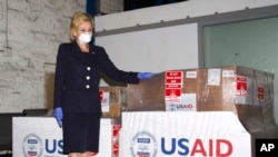 FILE - U.S. Ambassador to South Africa Lana Marks poses with ventilators donated by the U.S. Government, May 11, 2020.