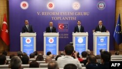 From left, Turkey's Justice Minister Abdulhamit Gul, Turkey's Foreign Minister Mevlut Cavusoglu, Turkey's Treasury and Finance Minister Berat Albayrak and Turkey's Interior Minister Suleyman Soylu speak to the press after their meeting in Ankara, Turkey, Dec. 11, 2018.