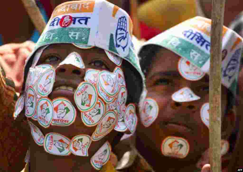 Supporters of India's ruling Congress party listen to Indian Prime Minister Manmohan Singh at an election rally in Kanpur, India, Friday, Feb. 17, 2012. Elections in Uttar Pradesh, India's most populous and politically crucial state, are being currently h