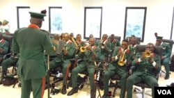 The National Assembly Guards Brigade performed Nigeria's national anthem and the U.N. anthem before the official reopening in Abuja. (Timothy Obiezu/VOA)