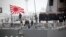 FILE - Sailors stand on deck of the Japanese destroyer Suzutsuki as it prepares to dock at a port in Qingdao in eastern China's Shandong Province, April 21, 2019.