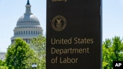FILE - The entrance to the Labor Department is seen near the Capitol in Washington, May 7, 2020. 