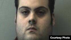 FILE - This booking photo released March 1, 2018, by the Beverly Police Department shows Daniel Frisiello, of Beverly, Mass., accused of mailing five envelopes earlier this month with threatening messages and a white substance, including one to Donald Trump Jr.