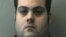 FILE - This booking photo released March 1, 2018, by the Beverly Police Department shows Daniel Frisiello, of Beverly, Mass., accused of mailing five envelopes earlier this month with threatening messages and a white substance, including one to Donald Trump Jr.