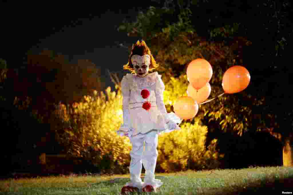 A boy dressed as Pennywise the Dancing Clown from the movie "It" poses for a photo during a Halloween party in Ciudad Juarez, Mexico.