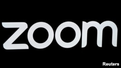 FILE - The Zoom Video Communications logo is pictured at the NASDAQ MarketSite in New York, April 18, 2019. 