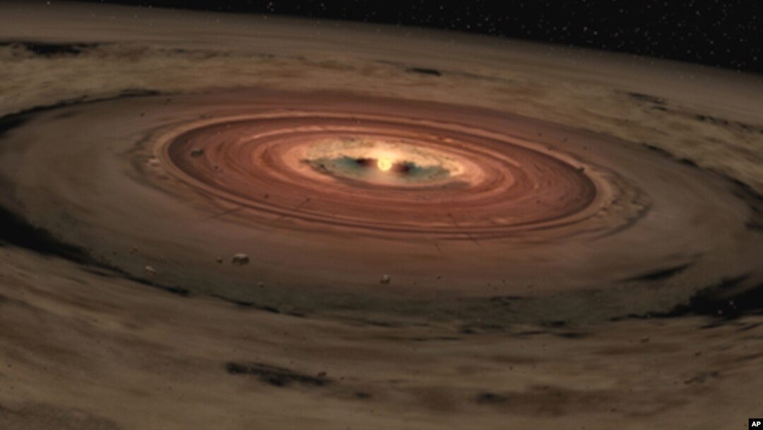 This artist's concept shows a brown dwarf surrounded by a swirling disk of planet-building dust. NASA's Spitzer Space Telescope spotted such a disk around a surprisingly low-mass brown dwarf, or "failed star." Astronomers believe that this unusual system