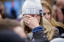 A supporter for Democratic presidential candidate and former Rep. Beto O'Rourke (D-TX) holds her face after O'Rourke announced he was dropping out of the presidential race, Nov. 1, 2019, in Des Moines, Iowa.