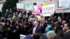 Senate Minority Leader Chuck Schumer speaks as U.S. Representative Maxine Waters stands next to him, while demonstrators rally outside the U.S. Treasury Department in Washington on Feb. 4, 2025. 