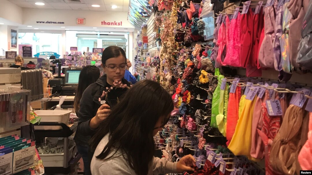 Young shoppers browse at a Claire’s store in the Newport Mall in Jersey City, New Jersey, Sept. 22, 2018. 