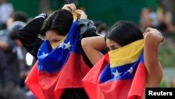 Para demonstran anti-pemerintah dalam protes di Caracas, Venezuela (14/3). (Reuters/Tomas Bravo)