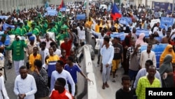 FILE - Somalis march against the Ethiopia-Somaliland port deal in Mogadishu, Somalia, on Jan. 11, 2024.