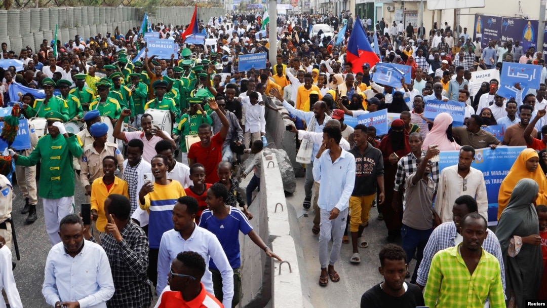 FILE - Somalis march against the Ethiopia-Somaliland port deal along KM4 street in Mogadishu, Jan. 11, 2024.