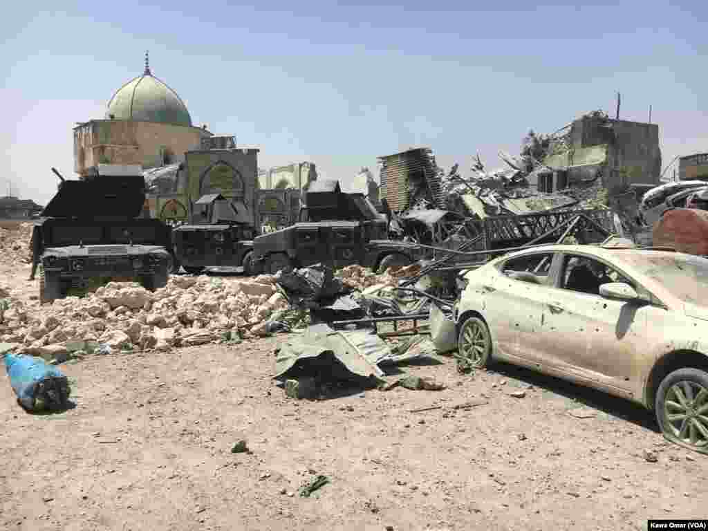 Much of the Old City of Mosul is in ruins as Iraqi forces battle Islamic State militants for the city. The destroyed al-Nuri mosque, shown in the background, shows the level of destruction in the city, July 1, 2017.