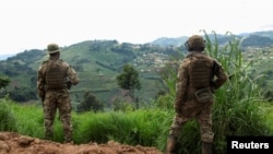 FILE - Members of the Democratic Republic of the Congo's army stand guard against the M23 rebel group in Lubero, North Kivu province, on Oct. 27, 2024. Officials said on Jan. 21, 2025, that M23 rebels recently have captured several key towns in South and North Kivu provinces.