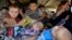 Displaced people, who fled from the violence in the province of Nineveh, arrive at Sulaimaniya province, Iraq, Aug. 8, 2014.